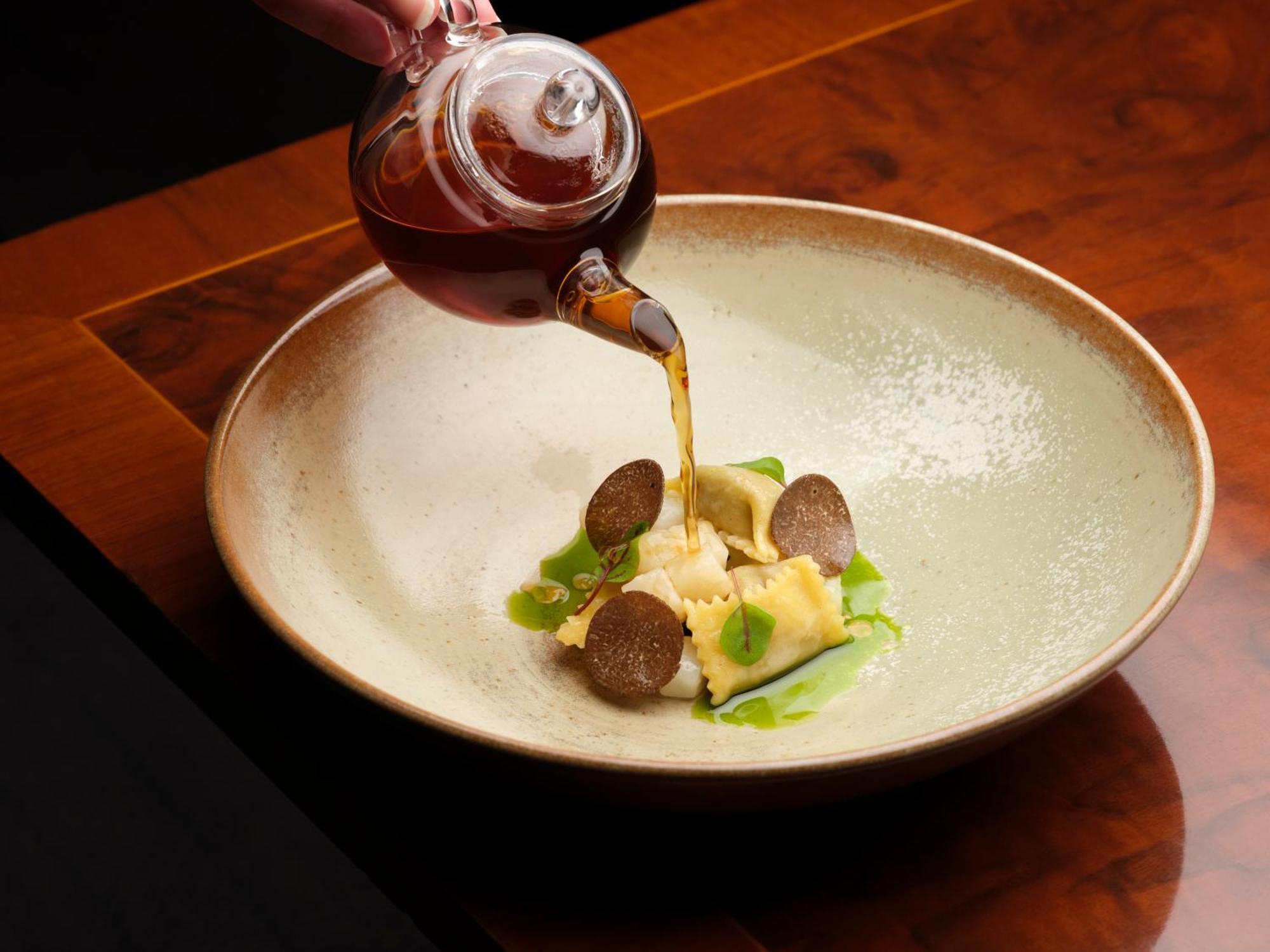 The Stafford London Hotel Bagian luar foto Soy sauce being poured onto a dish